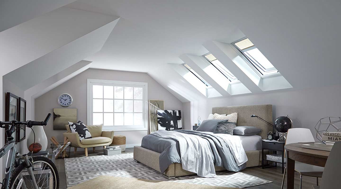 Installed Velux residential venting skylights in bedroom